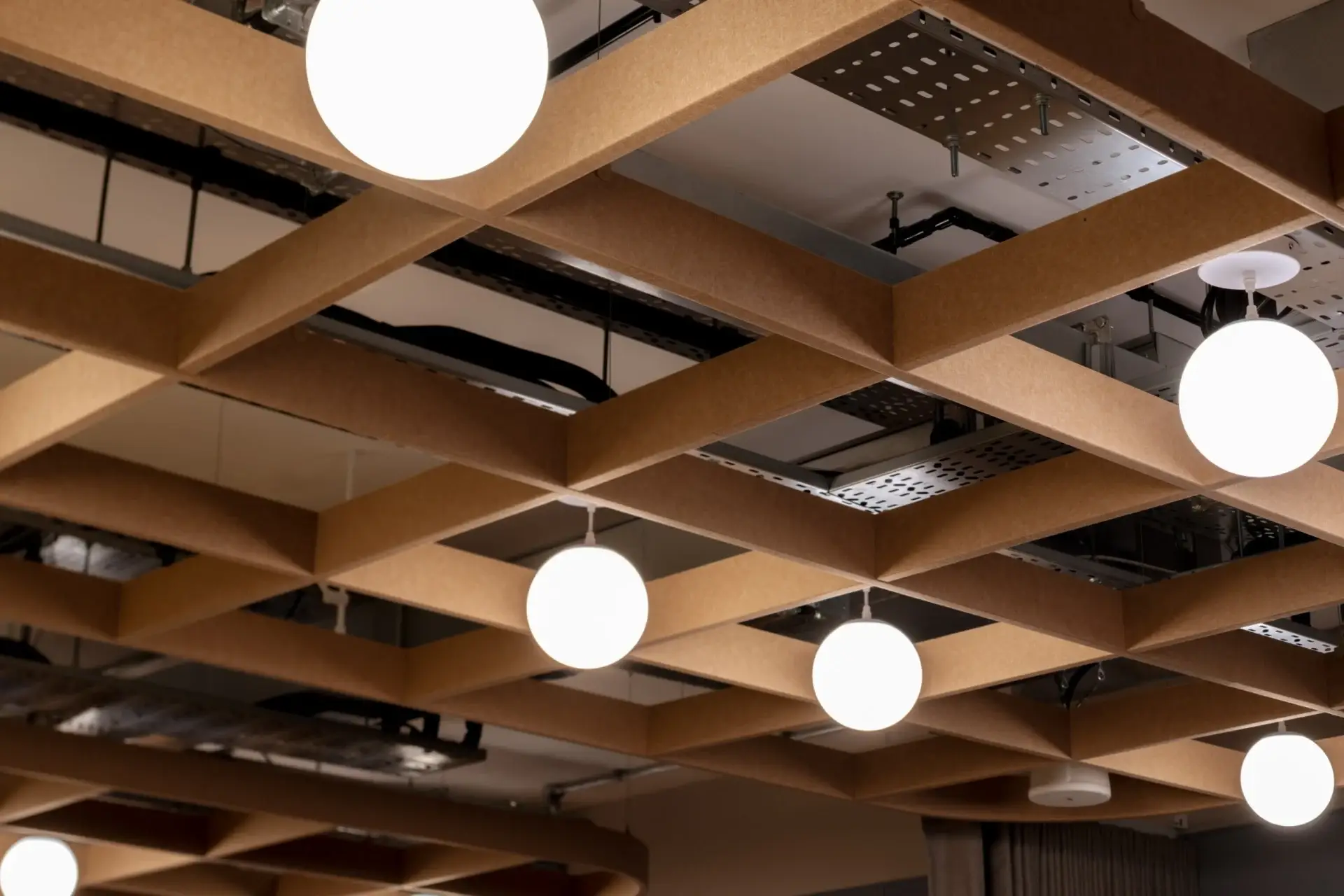 Felt coffered ceiling with globe pendants at Equal Experts